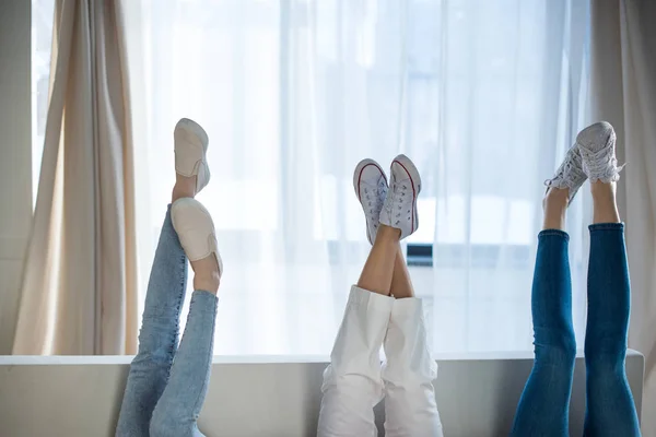 Women lying on sofa — Stock Photo