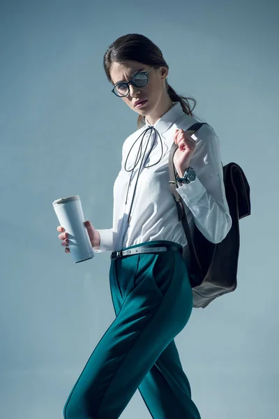 Hipster woman holding thermos — Stock Photo