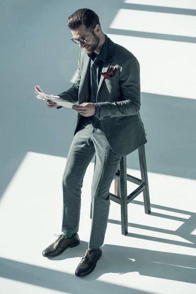 Handsome businessman with newspaper — Stock Photo