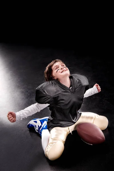 Boy playing american football — Stock Photo