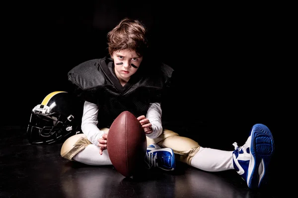 Junge spielt American Football — Stockfoto