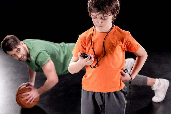 Man and boy training together — Stock Photo