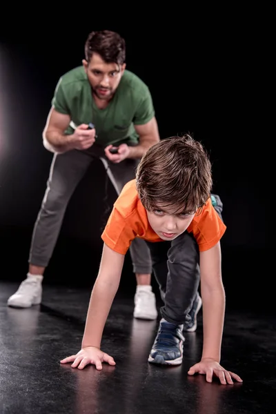 Man and boy training together — Stock Photo