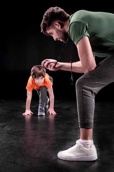 Man and boy training together — Stock Photo