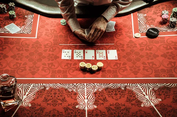 Croupier dealing card — Stock Photo