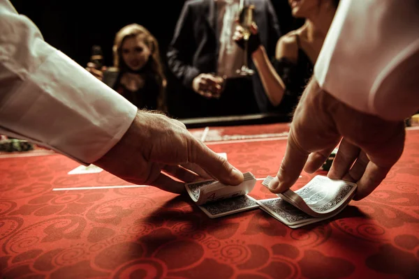 Dealer shuffling cards — Stock Photo