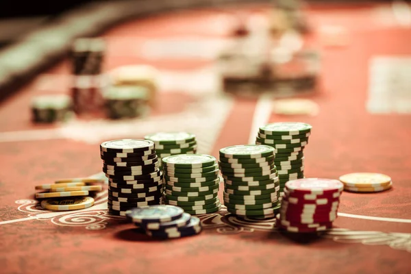 Poker chips on table — Stock Photo