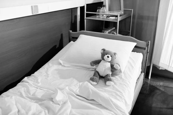 Teddy bear on hospital bed — Stock Photo