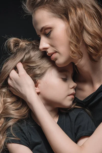 Daughter and mother hugging — Stock Photo