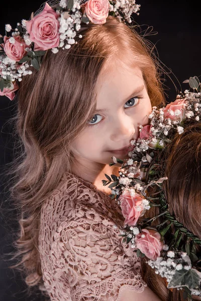 Girl with flowers wreath — Stock Photo