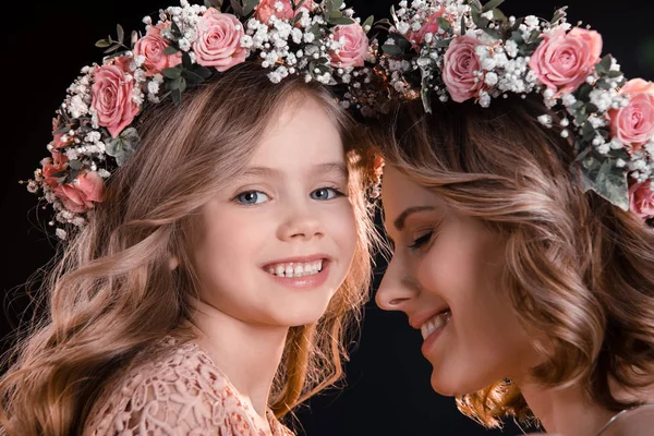 Mother and daughter in wreaths — Stock Photo