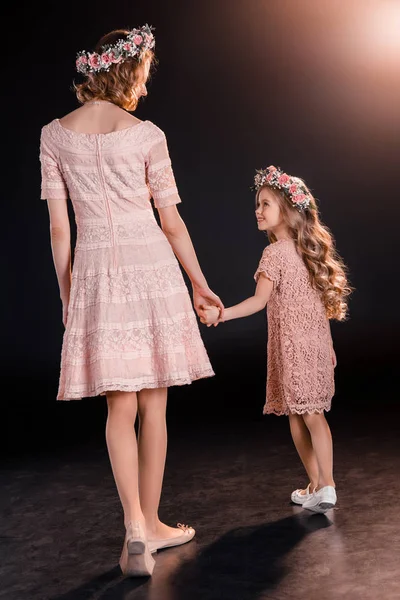 Mother and daughter in wreaths — Stock Photo