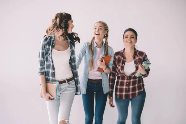 Young students with textbooks — Stock Photo