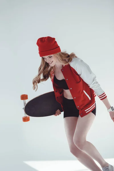 Hipster woman with longboard — Stock Photo