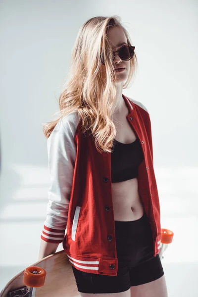 Hipster woman with longboard — Stock Photo