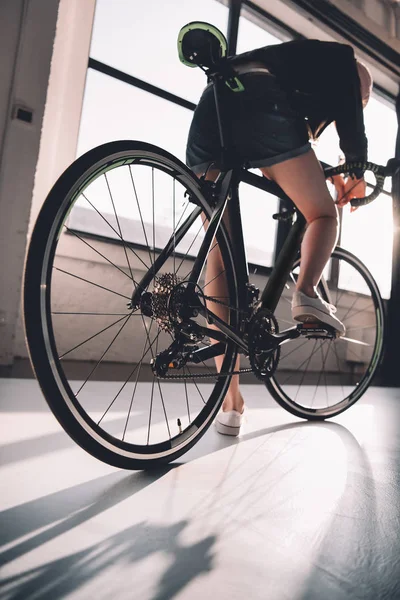 Woman riding bicycle — Stock Photo