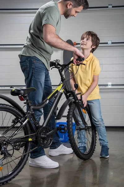 Father and son with bicycle — Stock Photo