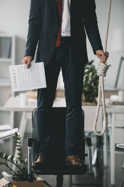 Businessman trying to hang himself — Stock Photo