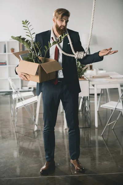 Businessman trying to hang himself — Stock Photo