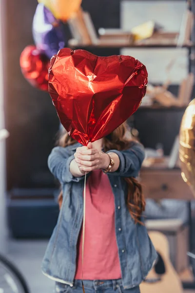 Woman holding balloon — Stock Photo