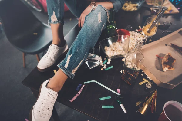 Woman in messy room — Stock Photo