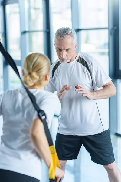 Sportswoman training with resistance band — Stock Photo