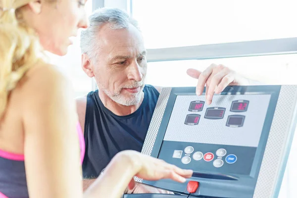 Trainer and sportswoman in gym — Stock Photo