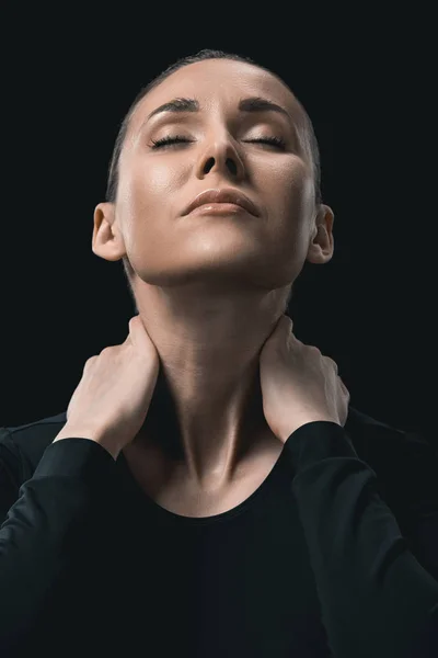 Sportswoman stretching neck — Stock Photo