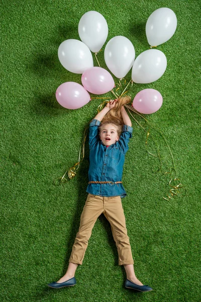 Little girl with balloons — Stock Photo