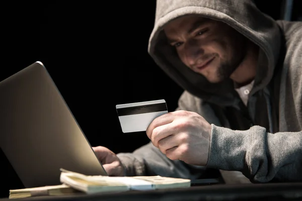 Hacker using laptop — Stock Photo