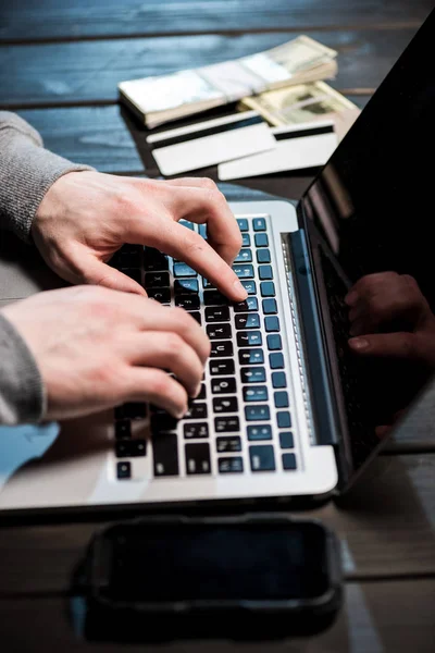 Hacker using laptop — Stock Photo