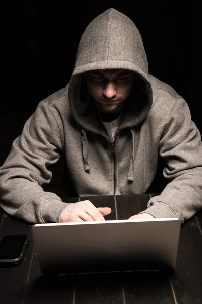 Hacker using laptop — Stock Photo