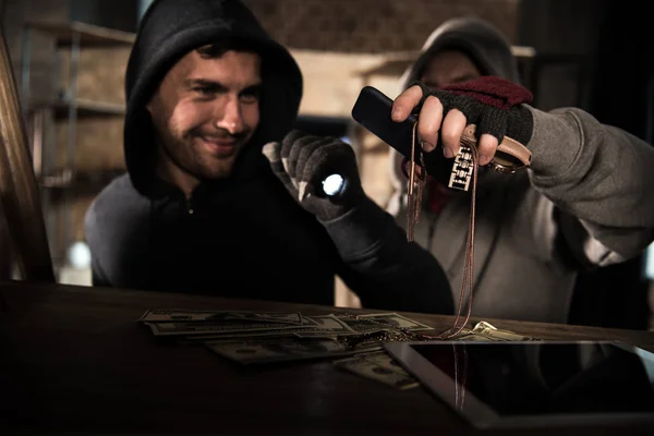 Robbers stealing money — Stock Photo