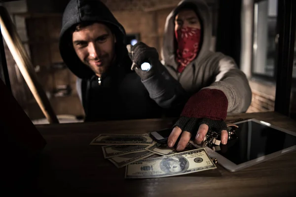 Robbers stealing money — Stock Photo