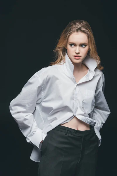 Woman standing and posing on black — Stock Photo