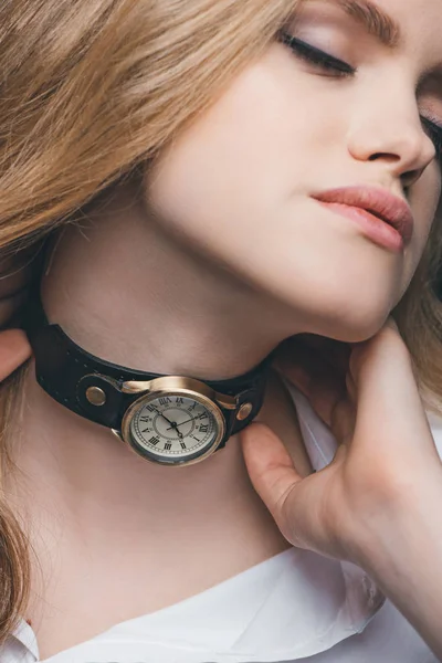 Girl fitting vintage watch on neck — Stock Photo