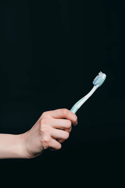 Female hand holding tooth brush — Stock Photo