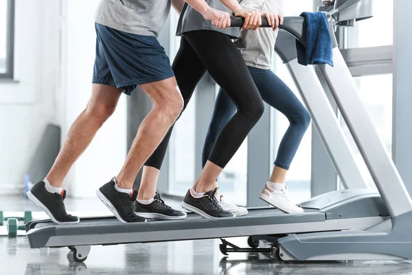 Family workout on treadmill, side view — Stock Photo