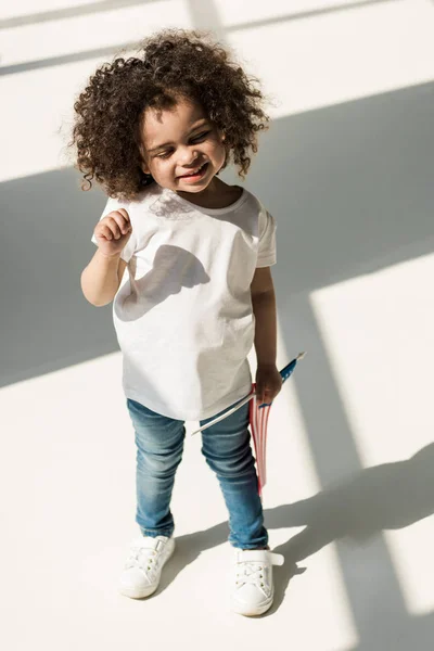 Baby girl with american flag — Stock Photo