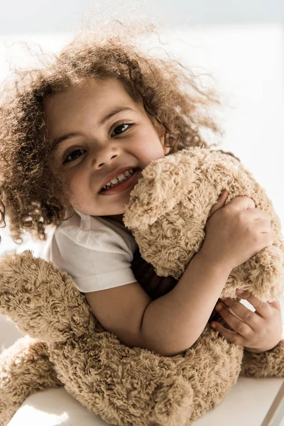 Baby girl with teddy bear — Stock Photo