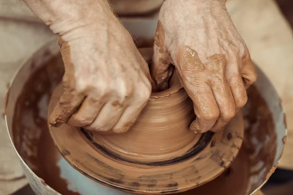 Close up of male craftsman working on potters wheel — Stock Photo