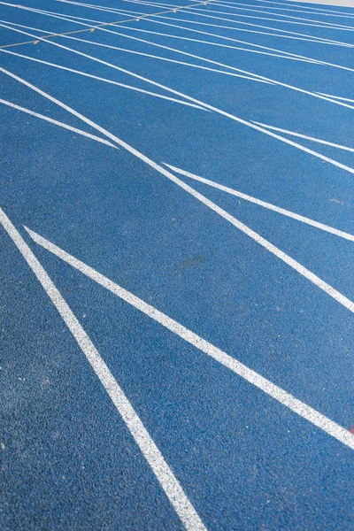 Blue running track — Stock Photo