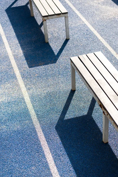 Benches on running track — Stock Photo