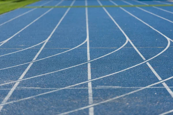 Blue running track — Stock Photo