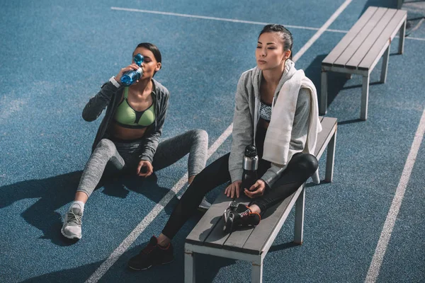 Young sportswomen on stadium — Stock Photo