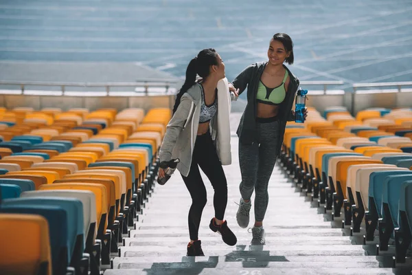 Young sportswomen on stadium — Stock Photo