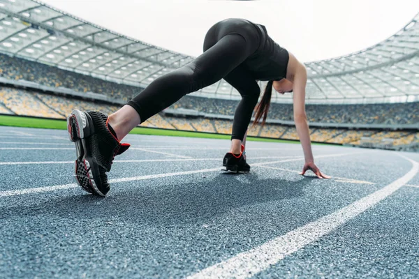 Sportswoman on starting line — Stock Photo