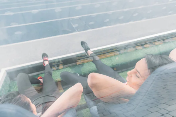 Sportswomen resting on stadium — Stock Photo