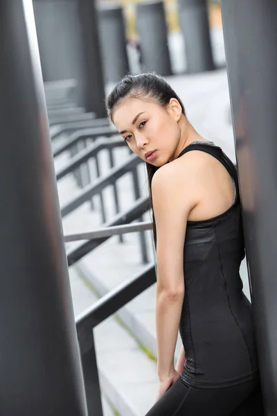 Sportswoman training on stadium stairs — Stock Photo