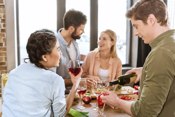 Young people partying at kitchen — Stock Photo